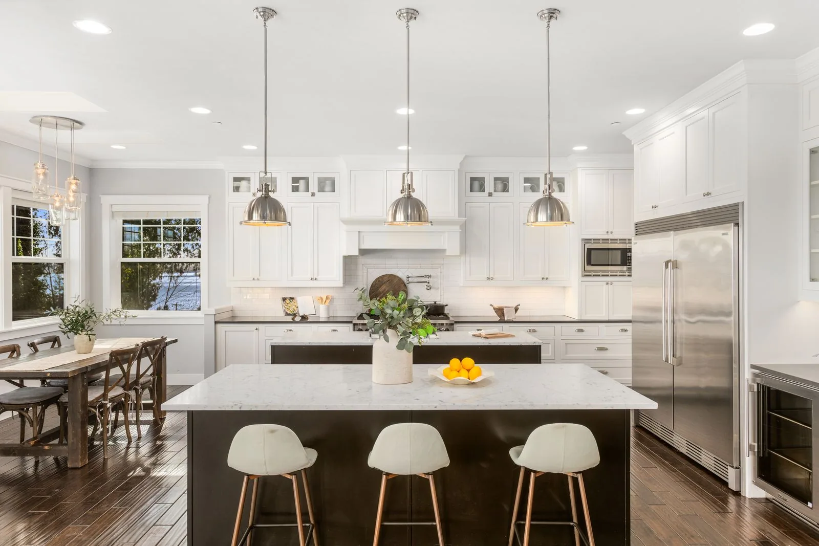 Bright white kitchen with a large island and pendant lighting